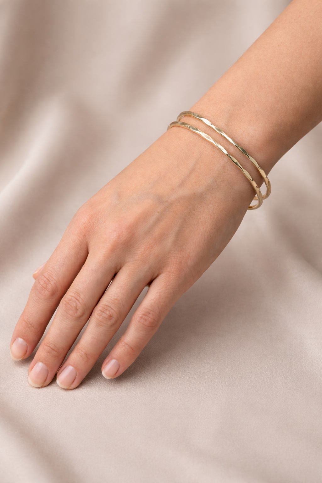 Bliss Cuff-Gold Model wearing the gold Bliss Cuff showing the adjustable double-band design.
