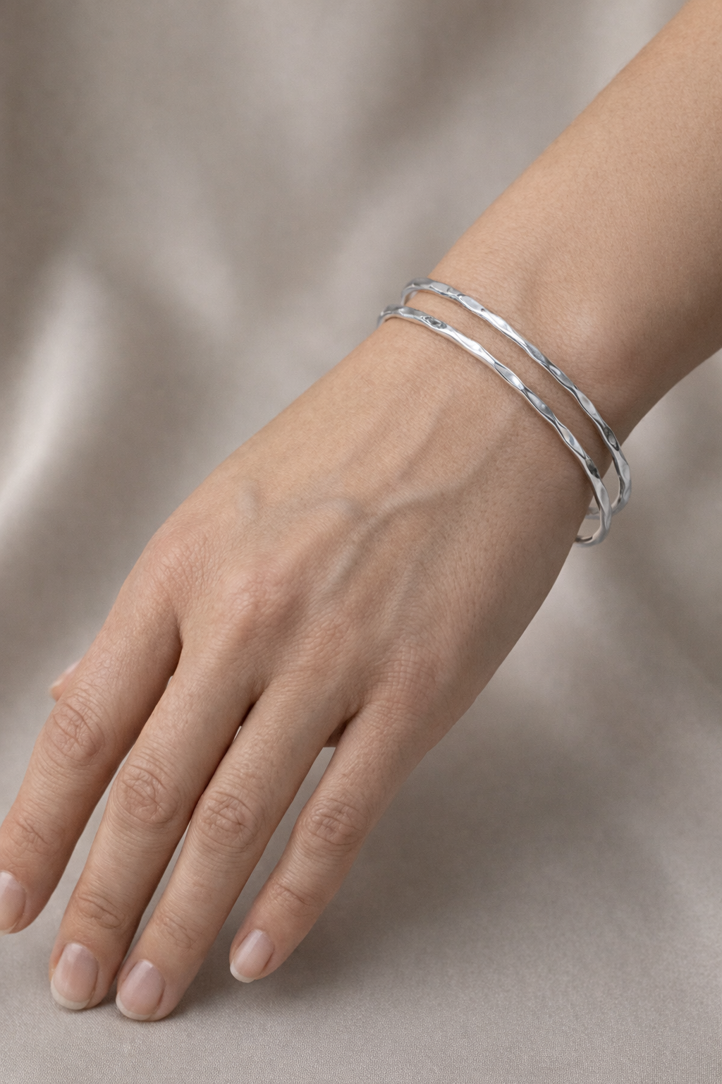 Bliss Cuff Silver Silver Bliss Cuff bracelet with hammered texture on a white surface.