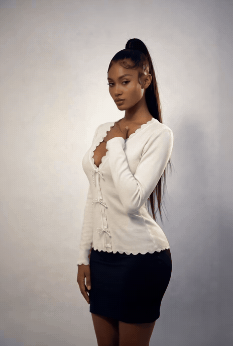 Pearl Bow Button Sweater in ivory with pearl bow buttons and scalloped trim front view