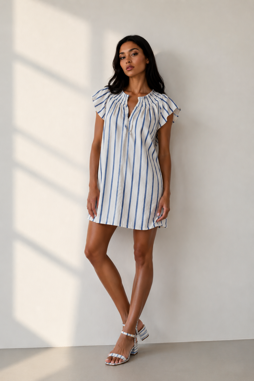 Shop the DayTrip Stripe mini dress at Madison Ave Boutique. A flattering blue and white striped summer dress by Sadie & Sage featuring a breezy, trendy fit.